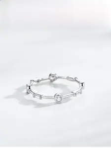 Detail of S925 silver ring featuring geometric round and baguette cubic zirconia stones
