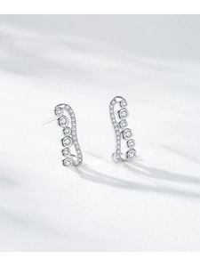 Detailed macro view of S925 sterling silver wave stud earrings with sparkling zircons
