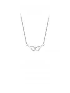 Macro shot of silver sterling necklace featuring an infinity pendant with micro-inlaid diamonds
