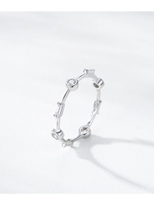 Macro detail of S925 silver ring featuring alternating round and baguette bezel-set zircons
