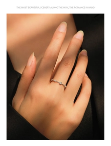 Detailed view of an S925 sterling silver geometric band ring with inlaid diamonds