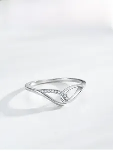 Detailed macro view of 925 silver V-shaped ring with pavé-set sparkling crystals