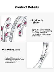 Detailed macro view of S925 sterling silver leaf ring with red and white zircons