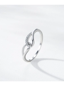 Macro shot of 925 sterling silver Mobius ring with pave cubic zirconia detailing