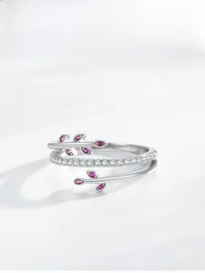 Detailed macro view of S925 sterling silver leaf ring with pink zircon and micro-pave diamonds