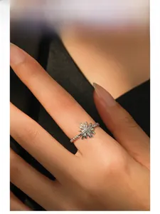 Detailed model shot of a vintage S925 silver sunflower ring with a twisted band design