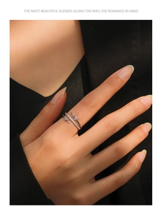 Close-up of S925 silver double-layer leaf ring with pink gems and diamonds on finger