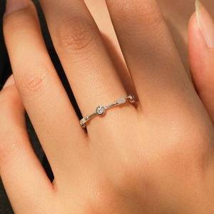 Minimalist S925 sterling silver geometric ring featuring alternating round and baguette gems
