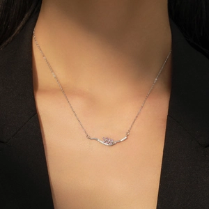 Elegant S925 silver wheat leaf necklace with pink zircon on a model in black suit