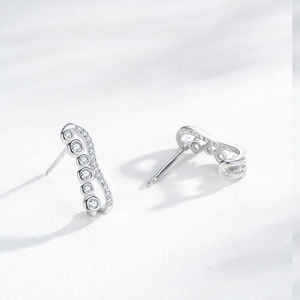 Elegant S925 silver wave stud earrings with sparkling cubic zirconia pavé stones