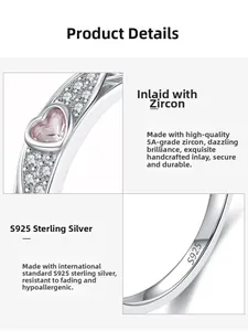 Macro shot of S925 sterling silver ring showing heart-shaped zircon and detailed engraving