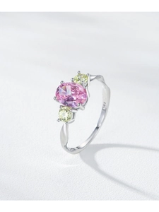 Detailed macro shot of S925 silver ring featuring pink oval stone and side yellow diamonds