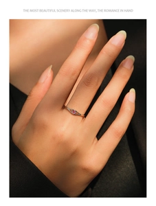 Detail of S925 silver ring featuring a pink round gemstone with olive hollow band design