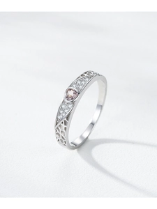 Detailed macro view of S925 silver heart ring with pink gem and hollow honeycomb side