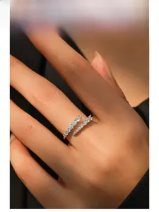 Close-up of S925 sterling silver open ring with double row of pavé set zircons on finger
