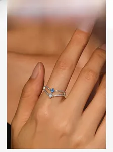 Close-up of double-layer V-shaped S925 silver ring with square blue gemstone
