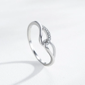 925 sterling silver angel wing ring with twisted Mobius design and pavé cubic zirconia