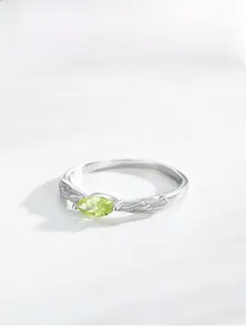 Macro shot of S925 sterling silver ring featuring marquise-cut apple green zircon stone