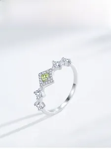 Detailed close-up of a crown ring with apple green square zircon and S925 silver finish