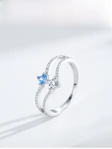 Macro detail of S925 sterling silver double layer ring with blue square-cut gemstones