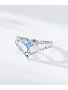 Detailed macro view of S925 sterling silver V-shaped ring with blue square gemstone