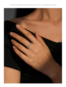Detailed view of an elegant S925 silver crown ring with a light green square zircon stone