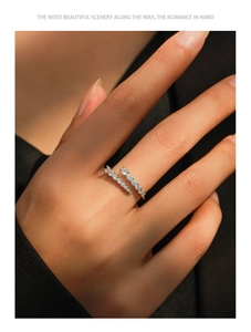 Macro detail of silver adjustable pavé ring with shimmering stones on a model hand