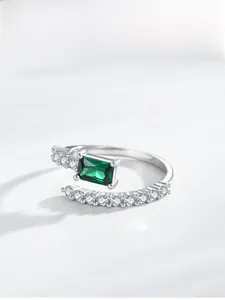 Detail view of square emerald cut green stone on S925 sterling silver open ring