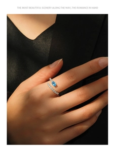 Macro shot of S925 sterling silver mermaid tear ring with blue teardrop gemstone