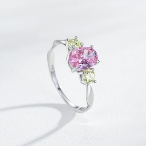 Elegant S925 silver ring with pink oval center stone and yellow side gems on white background