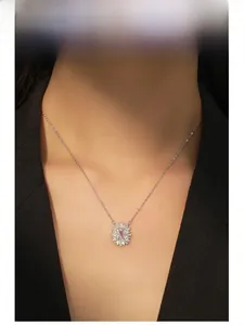 Close-up of S925 sterling silver necklace with pink square zircon and luxury floral pendant