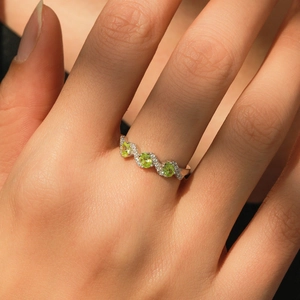 Elegant S925 sterling silver wave ring with oval green zircon and pavé crystals