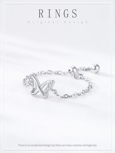 Close-up of S925 silver hollow butterfly ring with pavé crystals and adjustable chain