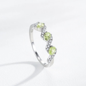 S925 sterling silver wave ring with green zircons and white diamonds on white base