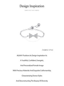 Macro detail of adjustable 925 sterling silver bow chain ring with pavé cubic zirconia