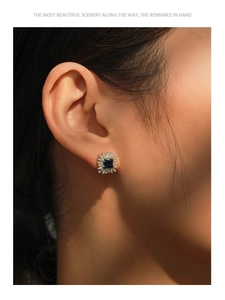 Close-up of S925 sterling silver stud earring with vintage blue square gemstone and zircon