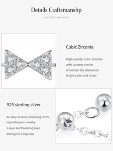 Macro shot of 925 sterling silver bow ring with S925 hallmark and cubic zirconia details