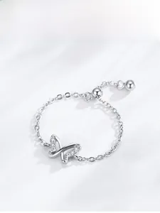 Detail of adjustable S925 silver chain ring with pavé butterfly charm and slider bead