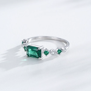 S925 sterling silver ring with emerald-cut green gemstone and cubic zirconia accents