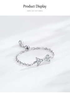 Detailed view of 925 silver bow chain ring with sparkling zircons and adjustable slider