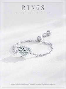 Detail of adjustable S925 silver chain ring featuring heart cut zircon with slider bead