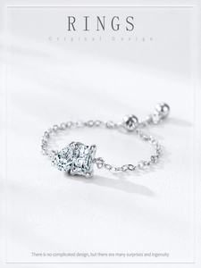 Detail of adjustable S925 silver chain ring with pear and square cut cubic zirconia
