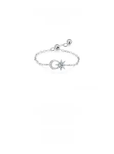 Macro view of S925 sterling silver moon and star chain ring with cubic zirconia stones
