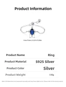 Macro detail of S925 sterling silver chain ring with an oval blue gemstone and specs
