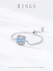 Macro detail of adjustable S925 silver chain ring with square blue zircon and pavé setting