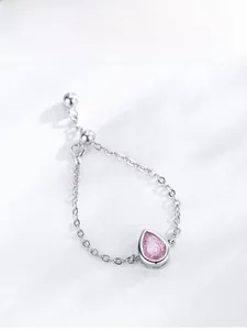 Detailed macro view of S925 silver adjustable chain ring with pink teardrop zircon stone