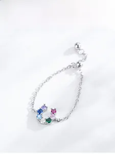 Macro view of S925 silver U-shape ring with multi-colored cubic zirconia stones