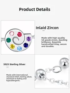 Macro shot of 925 silver snail charm with colorful cubic zirconia and S925 stamp