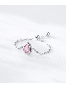 Macro detail of S925 sterling silver chain ring with pink teardrop zircon and slider