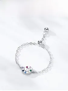 Detail of a 925 silver snail ring featuring multi-color stones and adjustable chain link